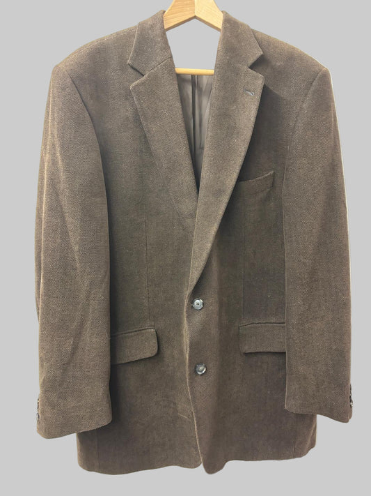 Brown blazer on a hanger against a white background